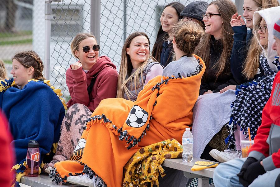 Beloit Buccaneers fans brave cool temps to cheer on their team at an April baseball game.