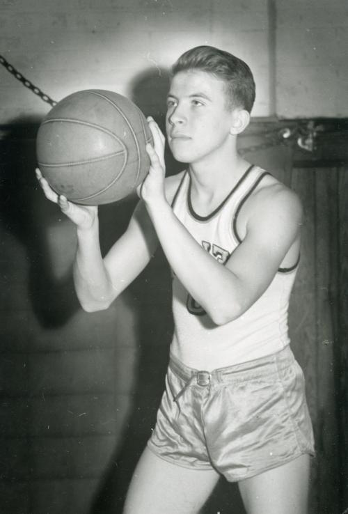 John Erickson'49 playing basketball as a student.
