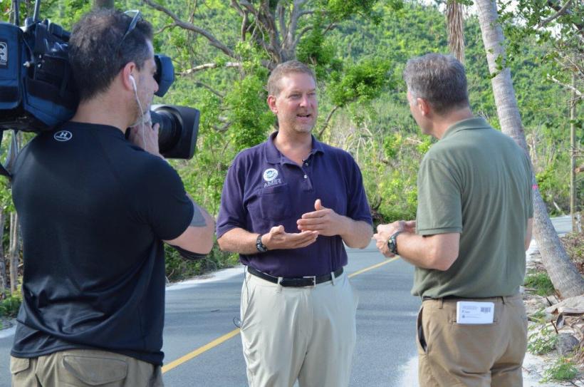 Patrick Cornbill talks to media after hurricanes hit the Virgin Islands in 2017.
